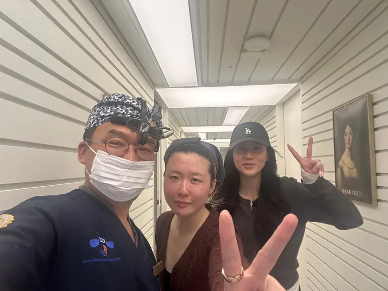 Dr. Kang taking a photo with a patient in a Pascal Clinic exam room, photo 7
