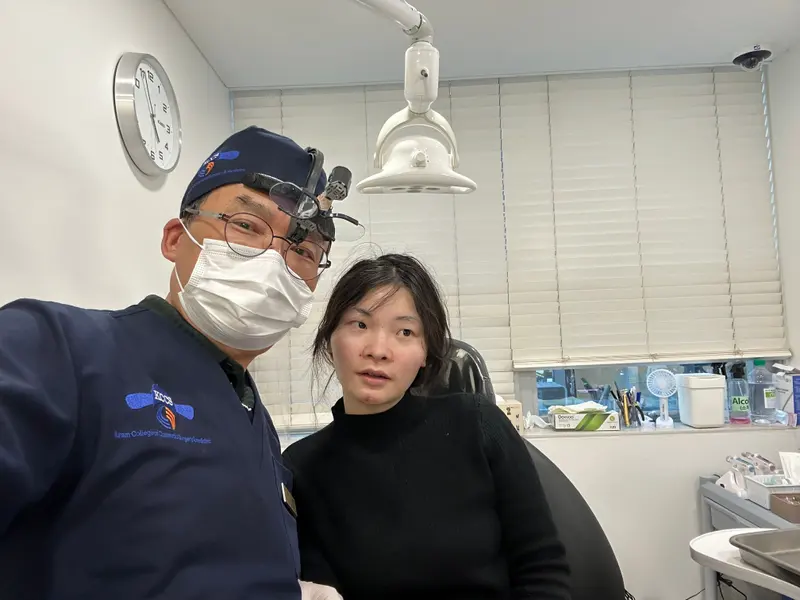 Dr. Kang taking a photo with a patient in a Pascal Clinic exam room, photo 9