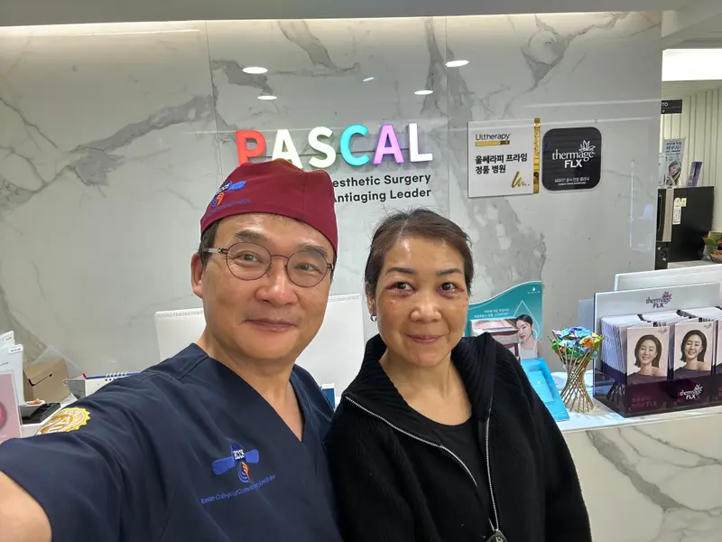 Dr. Kang taking a photo with a patient in a Pascal Clinic exam room, photo 12